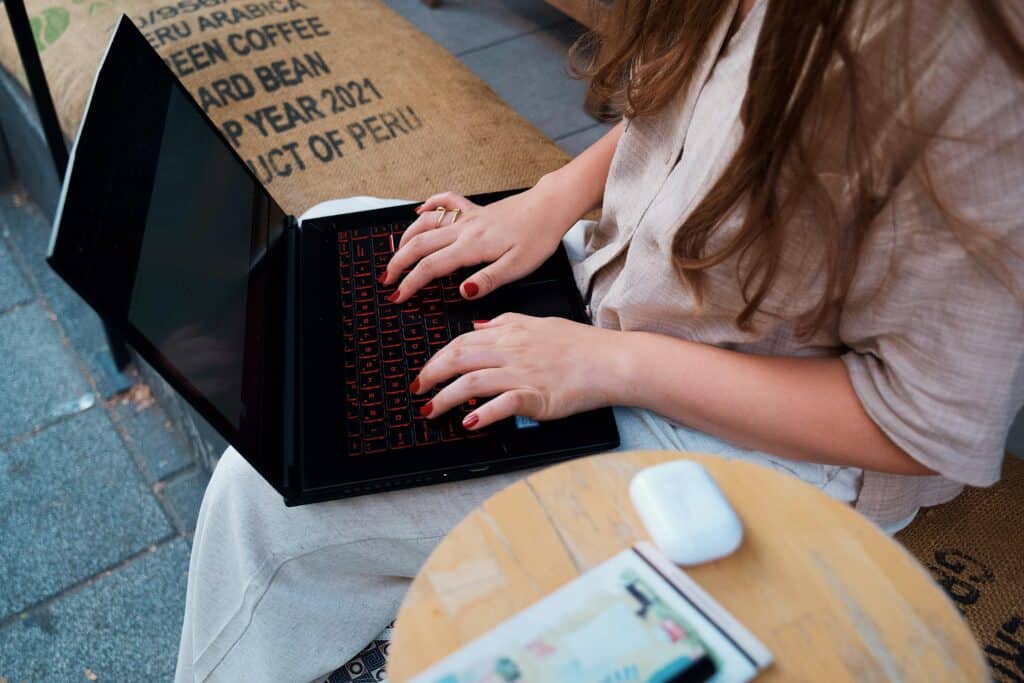 Writing blogs on a laptop